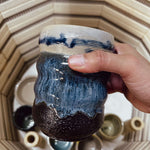 Participants painting 3D printed ceramics during a sound bath workshop in Berlin