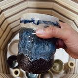Participants painting 3D printed ceramics during a sound bath workshop in Berlin