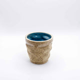 3D printed ceramic espresso cup with layered texture in sand beige – Migration of Matter